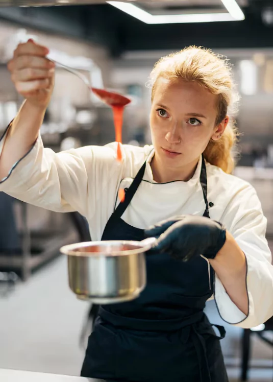 female-chef-preparing-sauce